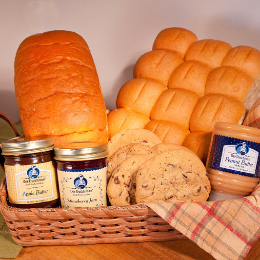 In our bakeries, there's always something delicious coming out of the ovens. A great idea for a gift or just for yourself, this bakery sampler bundle features our most popular bakery items.

Includes:
One 16 oz loaf of bread
Dozen of our soft melt-in-your-mouth dinner rolls (choice of wheat or white)
Half dozen chocolate chip cookies
One 13 oz squeeze bottle of our Amish Peanut Butter Spread
8 oz jar of Apple Butte
9 oz jar of Der Dutchman jam - choice of Red Raspberry, Strawberry, Strawberry-rhubarb or Pum