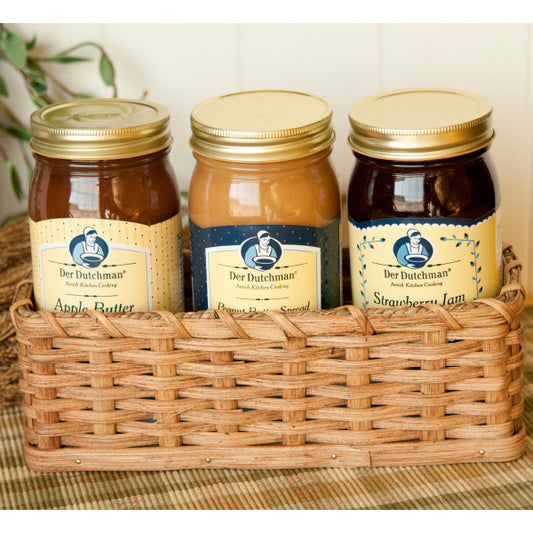 The three 16 oz. jars of Der Dutchman Apple Butter, Amish Peanut Butter spread and Jam settle nicely into this hand-crafted cracker basket. Amish-made and signed by a Fredericksburg, Ohio family of basket-makers, this cracker basket could be lined with a colorful cloth for serving cookies or crackers later.