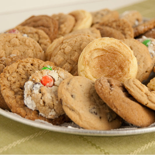 No time to bake for your party or family gathering? Let our experienced Amish bakers help you! Our homemade cookie trays are assembled, carefully wrapped and ready to serve. You can even freeze them for later use. Available in assorted trays with chocolate chip, molasses, snickerdoodle, oatmeal, peanut butter and monster cookies.

Cookies are approximately 3 inches in diameter.
