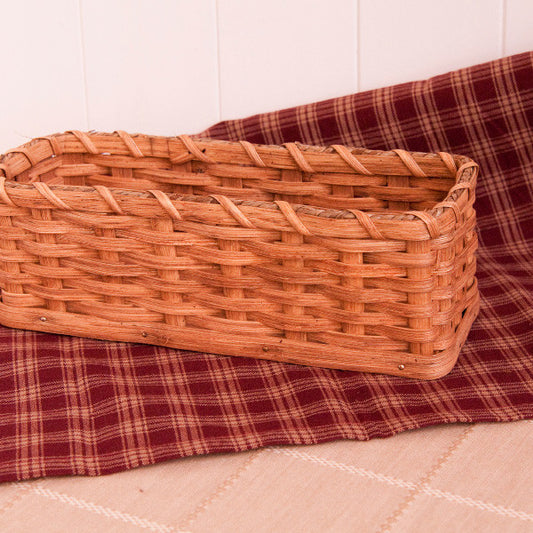 When you visit Amish Country, it's common to see reed baskets sold in simple stands at the roadside. They are sturdy, well-made and intended to last. Each Cracker Basket is signed and dated by the Miller family from Maysville, Ohio.

Made specially for Dutchman Online Store, our custom-made authentic Cracker Basket is approximately 10 inches long, 3.5 inches wide and 3.5 inches high.