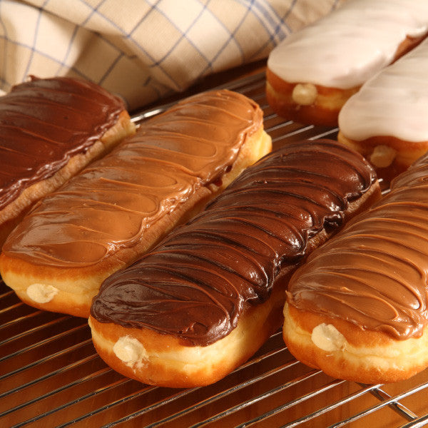 One of the most popular items in our bakeries, our Amish creamsticks (also known as eclairs or long johns) are a rich decadent treat. At approximately seven inches long, our homemade creamsticks will dwarf most commercial bakeries' pastries. The creamsticks (and all our bakery pastries) are fried in trans-fat free soybean oil then filled liberally with our light, fluffy bavarian cream. Baked and shipped from Ohio's Amish Country.

Comes as a half-dozen creamsticks and will ship un-iced for easier transit. Y